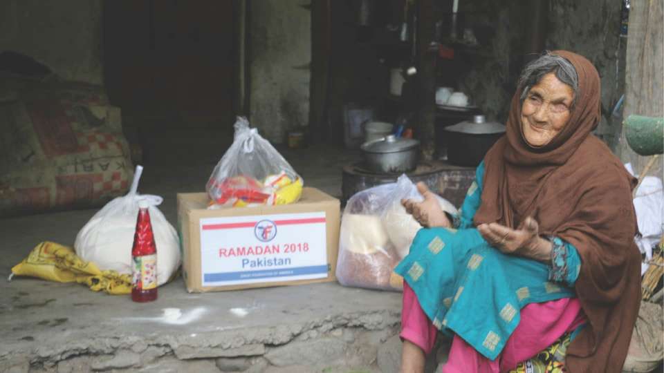 Woman giving thanks for Ramadan donations