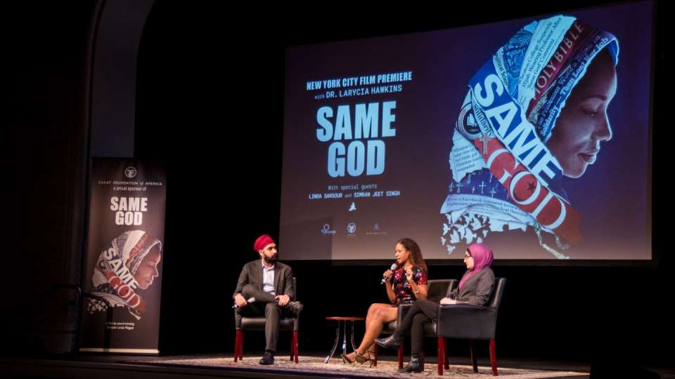 Dr. Larycia Hawkins (center) speaks with Dr. Simran Jeet Singh (left) and Linda Sarsour (right), a social justice activist of Palestinian descent, at the New York City film premiere of the documentary Same God. | Zakat Foundation of America photo