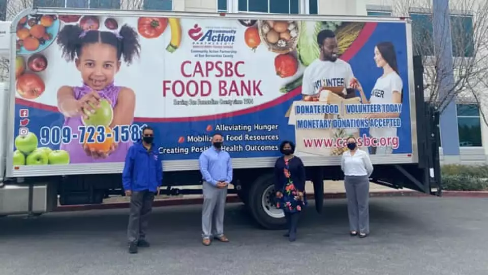 Photo SBC 5th District Supervisor's Office: Supervisor Joe Baca Jr. and CAPSBC CEO Patricia Nickols-Butler (both in center) preparing to distribute 1,000 boxes of food to the Rialto community and beyond on March 27.