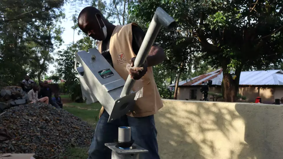 Fixing the spout, which allows for easier fill-ups when residents bring their containers. – Zakat Foundation of America photo