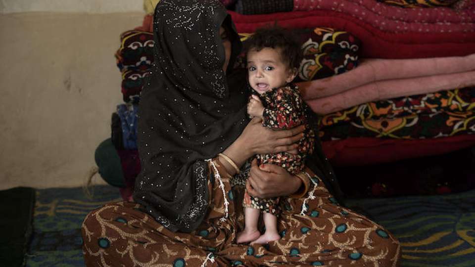 Shukuriya, 8 months old, of Kandahar, Afghanistan, suffers from severe acute malnutrition. A UNICEF-supported mobile health and nutrition team provided her parents with Ready-to-Use Therapeutic Food, a nutrient-rich peanut paste, to begin treatment. © UNICEF/UN0562535/ROMENZI