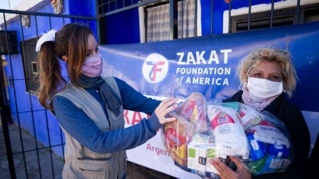 Veronica De Pasquale, Zakat Foundation of America’s Argentina director, distributes a food package during Ramadan 2021. | Zakat Foundation of America photo