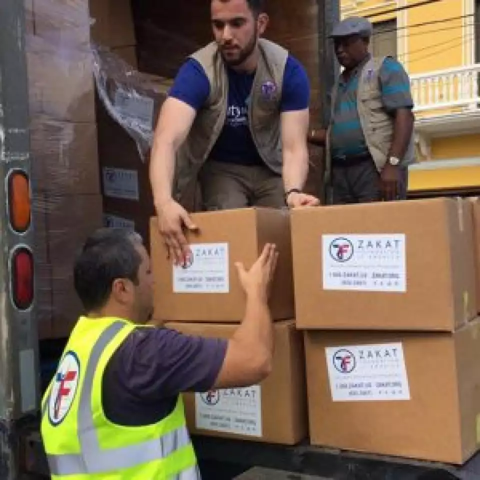 Abdelhamid helps unload a truck carrying humanitarian aid.