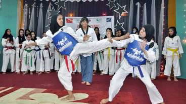 APP08-080623 SARGODHA: June 08 - Taekwondo girls show off their skills during inauguration ceremony of “Bashir Begum Chaudhry Girls Orphanage” building for orphan girls at Khubaib Girls School and College donated by Zakat Foundation America. APP/HSD/MAF/ZID