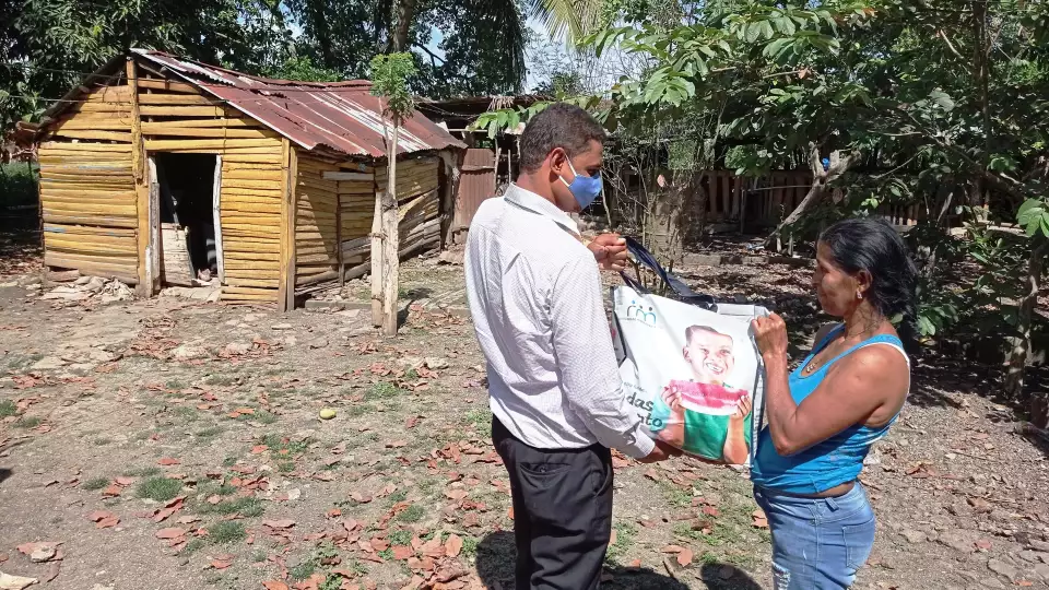 distributing food to the local beneficiaries in dominican republic