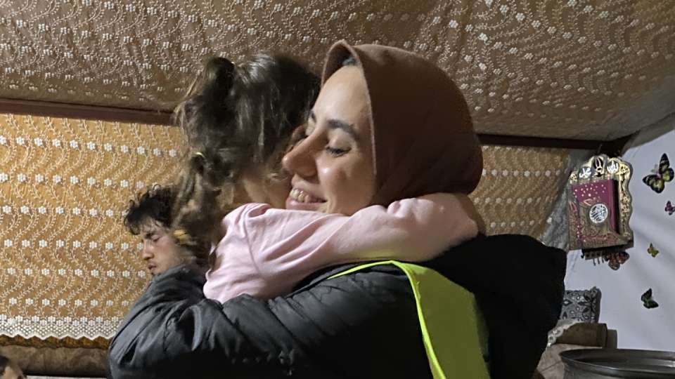 Hugs exchanged at the tent village for earthquake survivors /  تبادل العناق في قرية الخيام