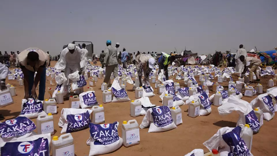 Essential food staples being prepared for distribution for displaced families in Sudan