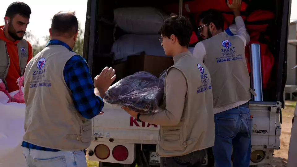 Field teams in Jordan unlock winter items for distribution to needy families