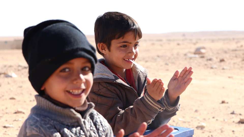 Boys clapping in Jordan.