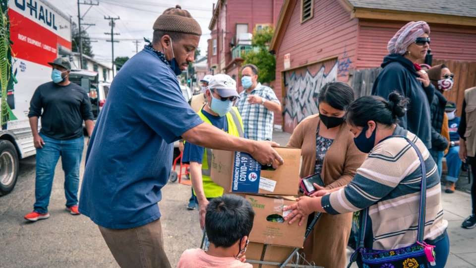 Zakat worker handing out donations to families in the USA