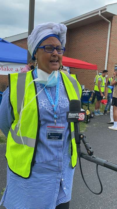 Donna Neil-Demir, RN, Zakat Foundation of America’s health advisor, speaks to the press at a COVID-19 food distribution in Springfield, Illinois, on July 3, 2020. Neil-Demir is often on the ground, providing food, clothes and medical attention as part of her work with the organization. | Zakat Foundation of America photo
