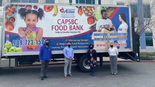 Photo SBC 5th District Supervisor's Office: Supervisor Joe Baca Jr. and CAPSBC CEO Patricia Nickols-Butler (both in center) preparing to distribute 1,000 boxes of food to the Rialto community and beyond on March 27.