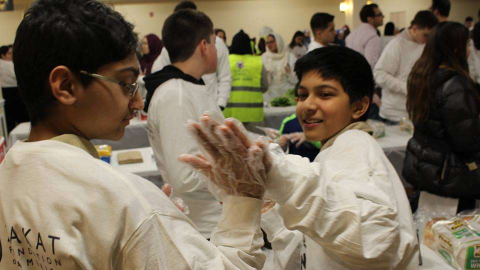 Volunteers share a high five for hard work!