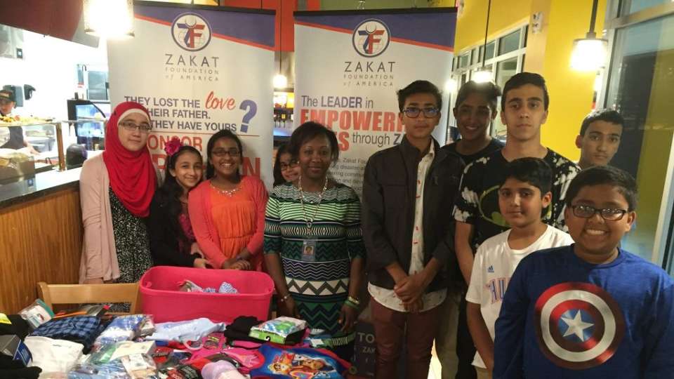 Zakat Foundation of America volunteers collect clothing for foster children in the U.S.