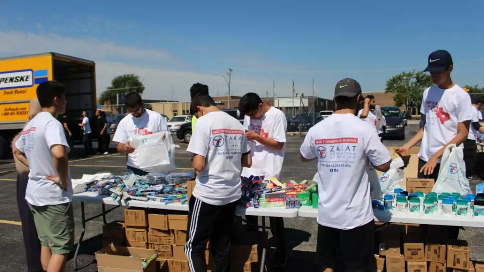 Volunteers prepare aid packages for Hurricane Harvey victims at Zakat Foundation of America headquarters in Chicago.