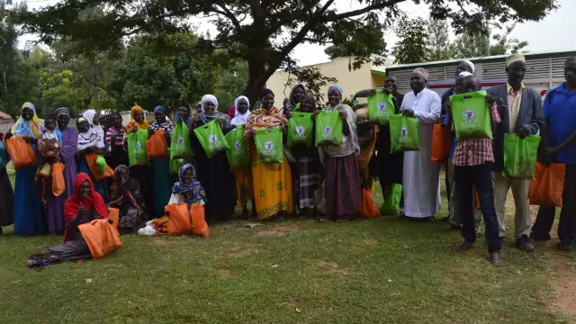 6 kenya udhiya beneficiaries displaying their packages