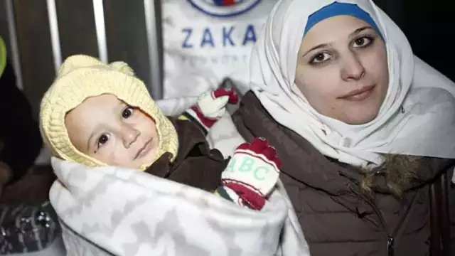 mother child recieving winter kits