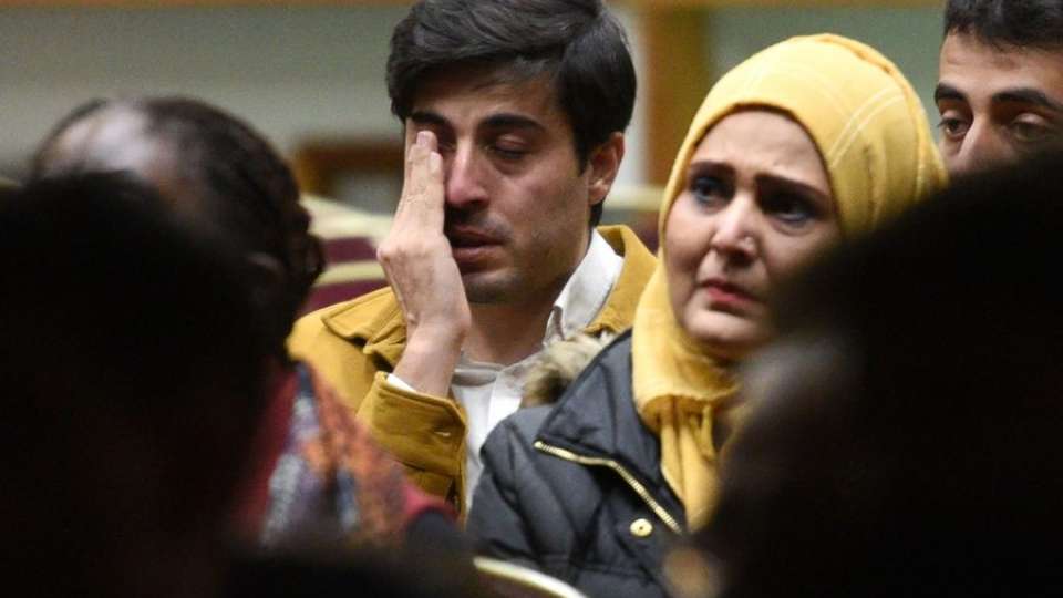 Mehmet Deniz of Hoffman Estates wipes away a tear as he watches a video of earthquake devastation in Turkey. Deniz said he lost over 100 family members in Antakya, Turkey. Rick West | Staff Photographer