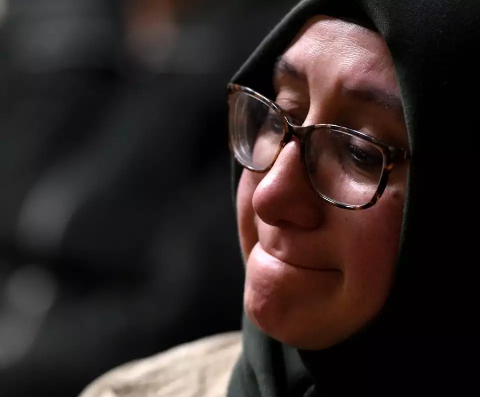 Ikbal Koseli of Arlington Heights fights back tears during Thursday night's vigil for those in the earthquake-affected areas in Turkey and Syria. Koseli was one of the events organizers. - Rick West | Staff Photographer