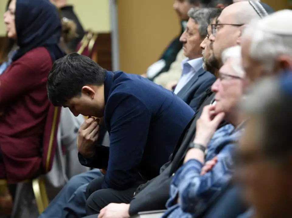 A man bows his head during the vigil in Mount Prospect for those in the earthquake-affected areas of Turkey and Syria. The Mount Prospect-based Turkish American Society of Chicago hosted the event. - Rick West | Staff Photographer