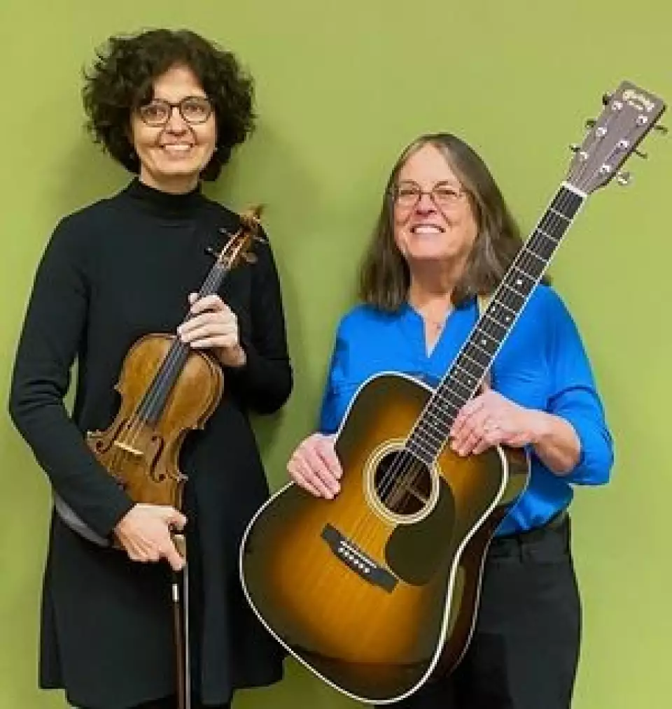 McHenry County College music instructor Pat Gaughan, right, and violin teacher Nancy Maio will present "Both Sides Now" on Thursday at the Crystal Lake college. The program explores social justice, civil rights, peace movements, and feminism through the songs of artists such as Joni Mitchell, Mary Travers, Joan Baez and Judy Collins. - Courtesy of McHenry County College