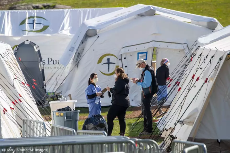 Medical personnel work at the Samaritan's Purse field hospital for COVID-19 patients in New York's Central Park on April 1. (© Mary Altaffer/AP Images)
