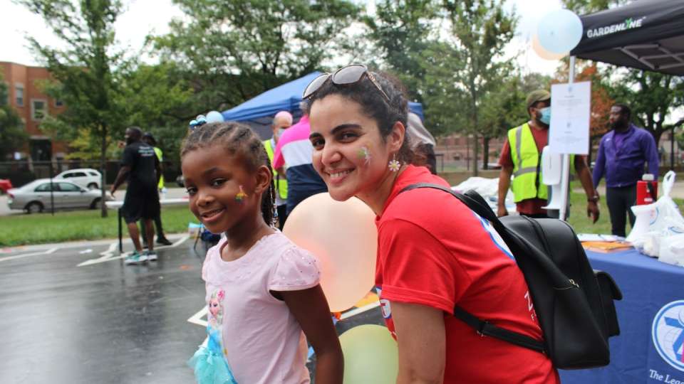 Smiles all around at a Chicago school supply distribution