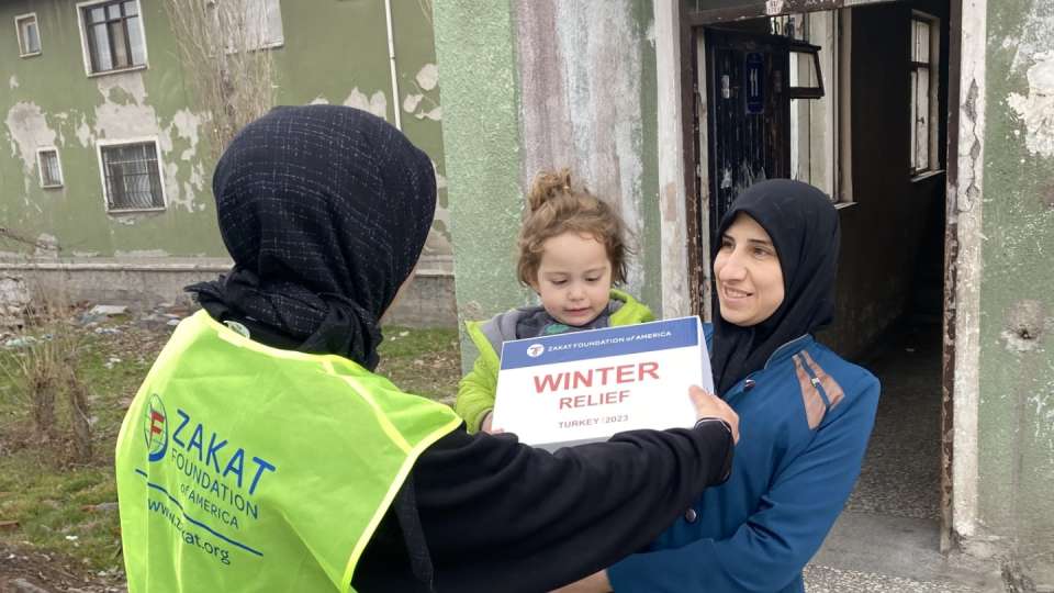 Winter packages are a welcomed relief for families in need / العائلات المحتاجة سعيدة لتقيها الإغاثة الشتوية