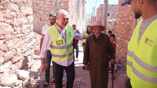 Image of Mr. Demir with other relief workers and impacted people