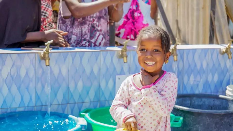 The bright smile is for clean water