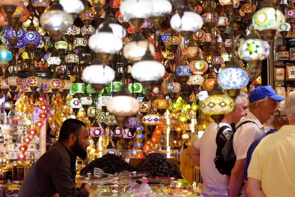People stand at a store selling decorations at the Souq Ramadan in Dubai on March 20, 2023 ahead of the Muslim holy fasting month of Ramadan. KARIM SAHIB, AFP Via Getty Images