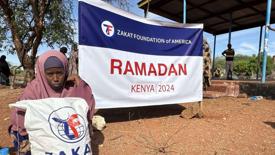 A mother in Kenya receives her Ramadan food package