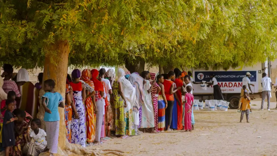 Families line up for distribution in Senegal