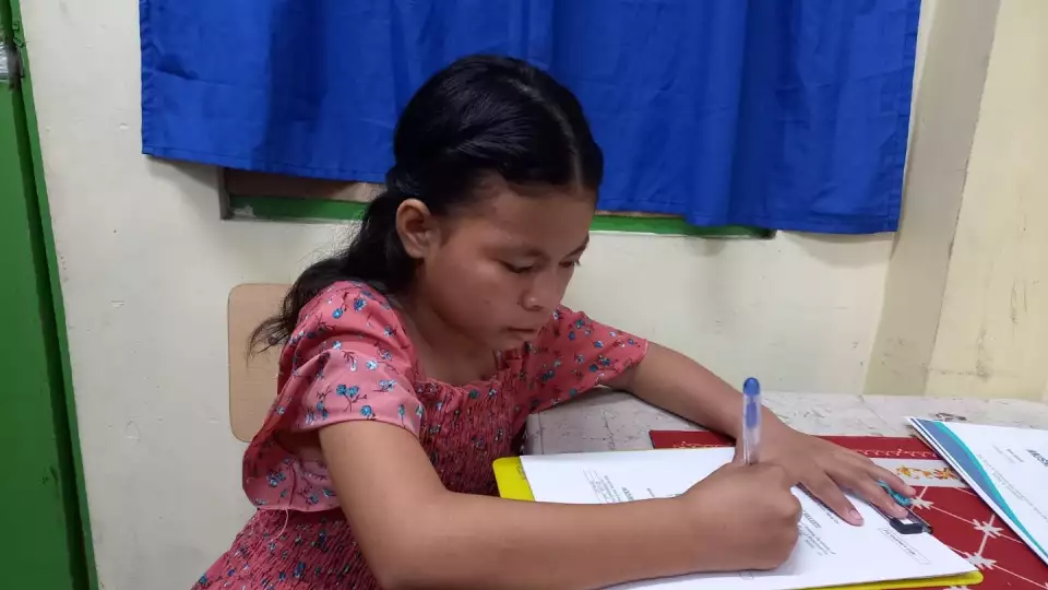 Our sponsored orphan busy learning
