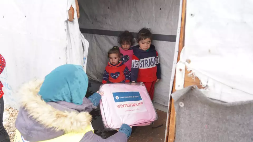 Three young children in need receive a much needed Winter Relief Package