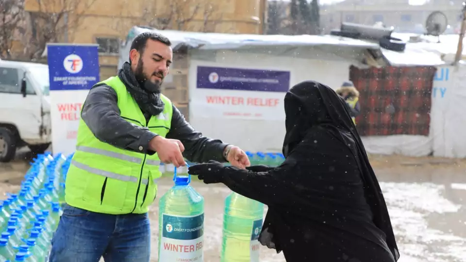 Lebanon receives winter relief items including cooking oil to ease the difficulty of hungry persons