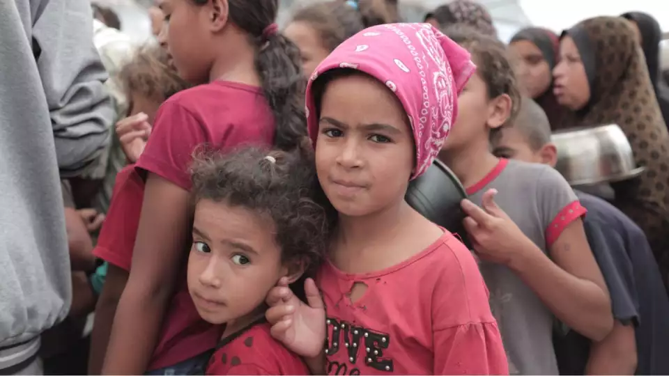 Children in Gaza and feed in Zakat Foundation of America hot soup community kitchens