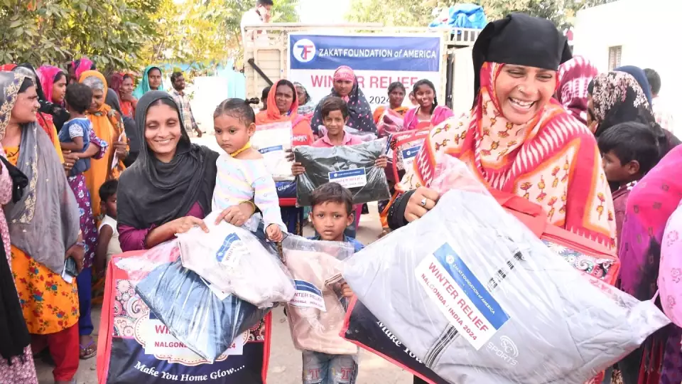 Joy all around after receiving winter relief items in India.