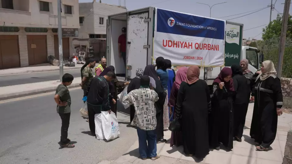 Residents in Jordan line up for Udhiyah-Qurbani meat distribution to share a nourishing meal with their loved ones