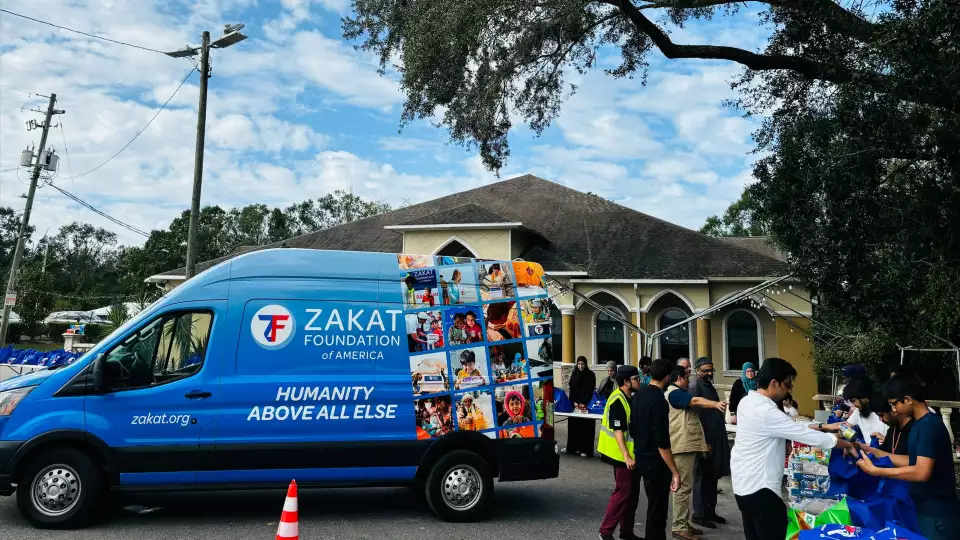 Volunteers unload hurricane relief supplies for families affected by Hurricane Helene
