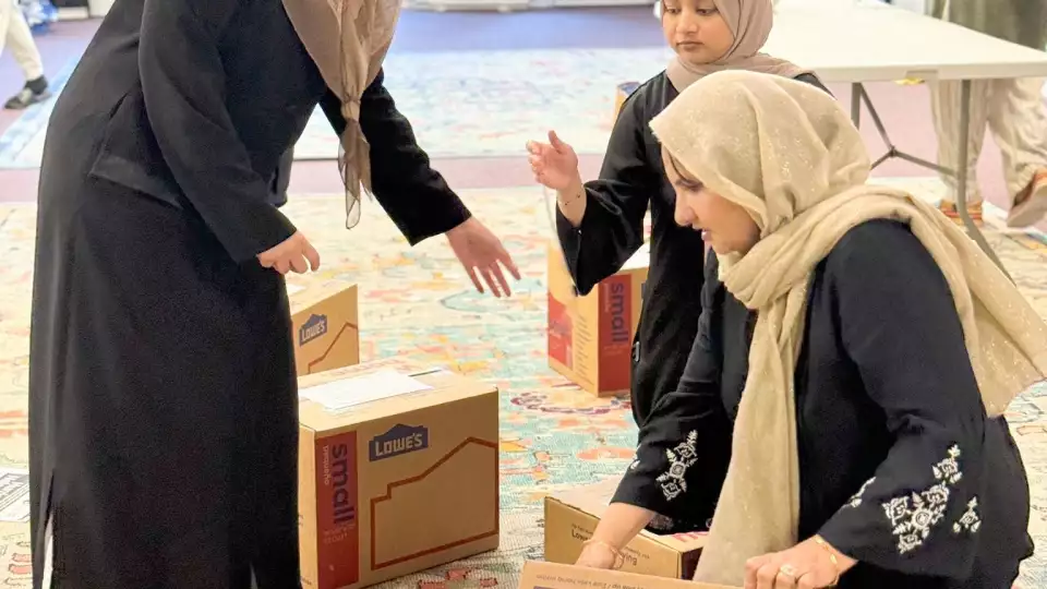 Volunteers in North Carolina pack boxes with hurricane relief supplies