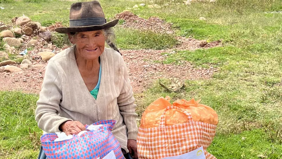 A smile that warms our hearts from an elderly woman in Bolivia after receiving our food package.