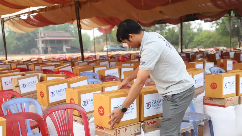 Our field member in Cambodia puts the final touches at our Ramadan food package distribution location.