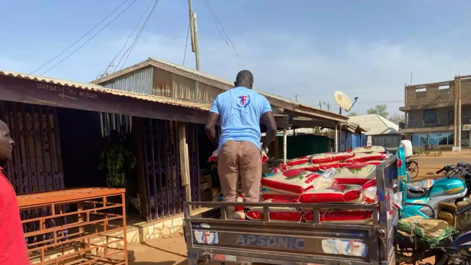 Our field reps in Benin distribute food packages to food insecure families.