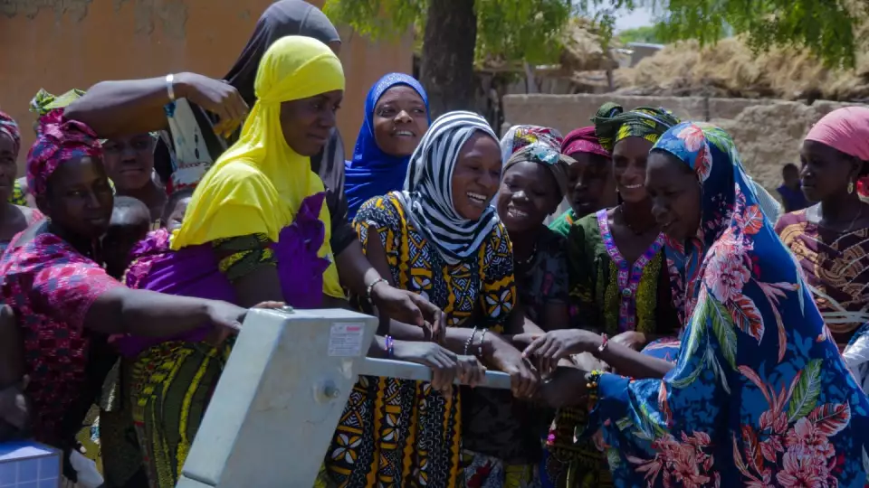 Women in Mali celebrate access to clean water as respite from long dangerous walks to contaminated water sources.