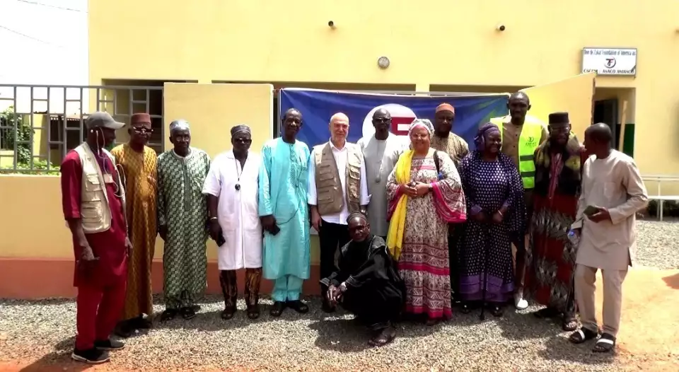 Mr. Halil Demir and Zakat Foundation of America staff pose outside the newly completed mental health unit.