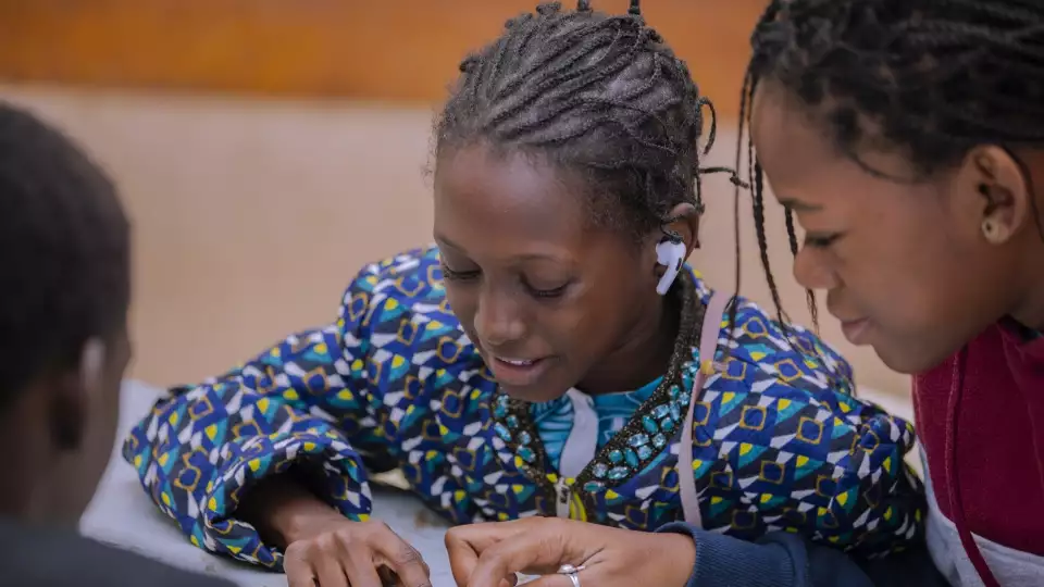 Senegalese sponsored orphans take time to play a game together.