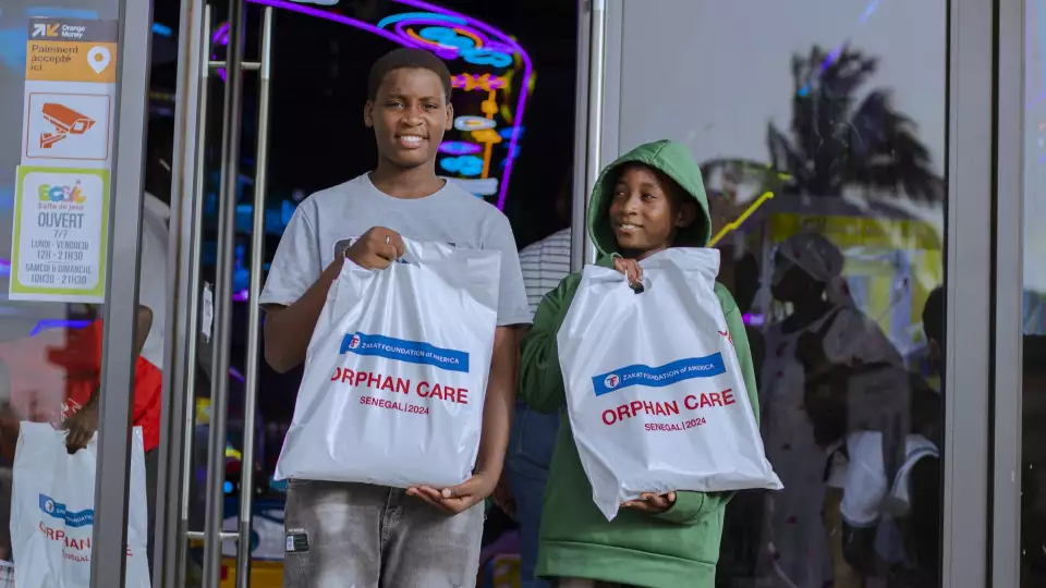 Stand with orphaned children to ensure they feel loved and seen.