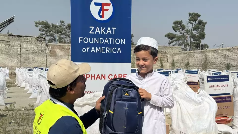 Thanks to your support, an orphan boy in Afghanistan receives a school bag, gaining access to education and a brighter future.