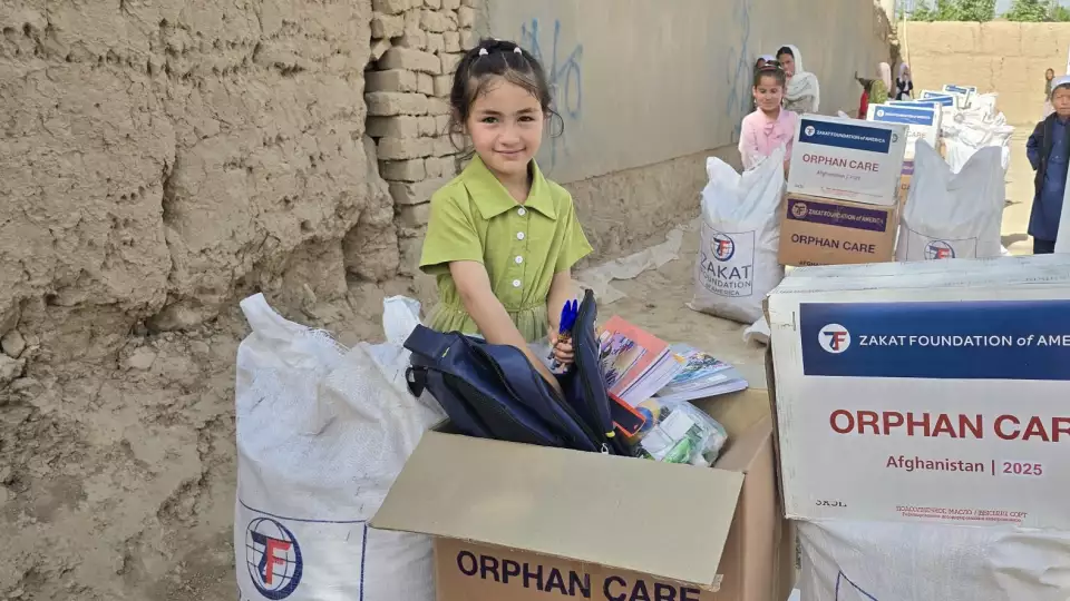 Your support helps an orphan girl in Afghanistan receive school supplies from Zakat Foundation of America, ready to begin her journey in education.